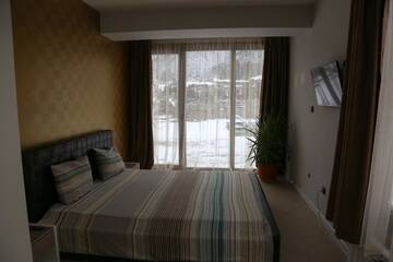 Фото номера Дом с 5 спальнями Гостевой дом Holiday House Kubrat г. Сапарева-Баня 34